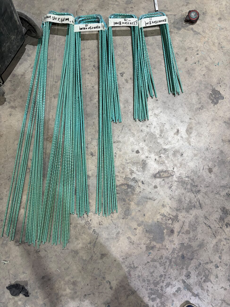 Labelled GFRP bent bars laid out by mark number